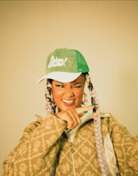 a woman wearing a green hat